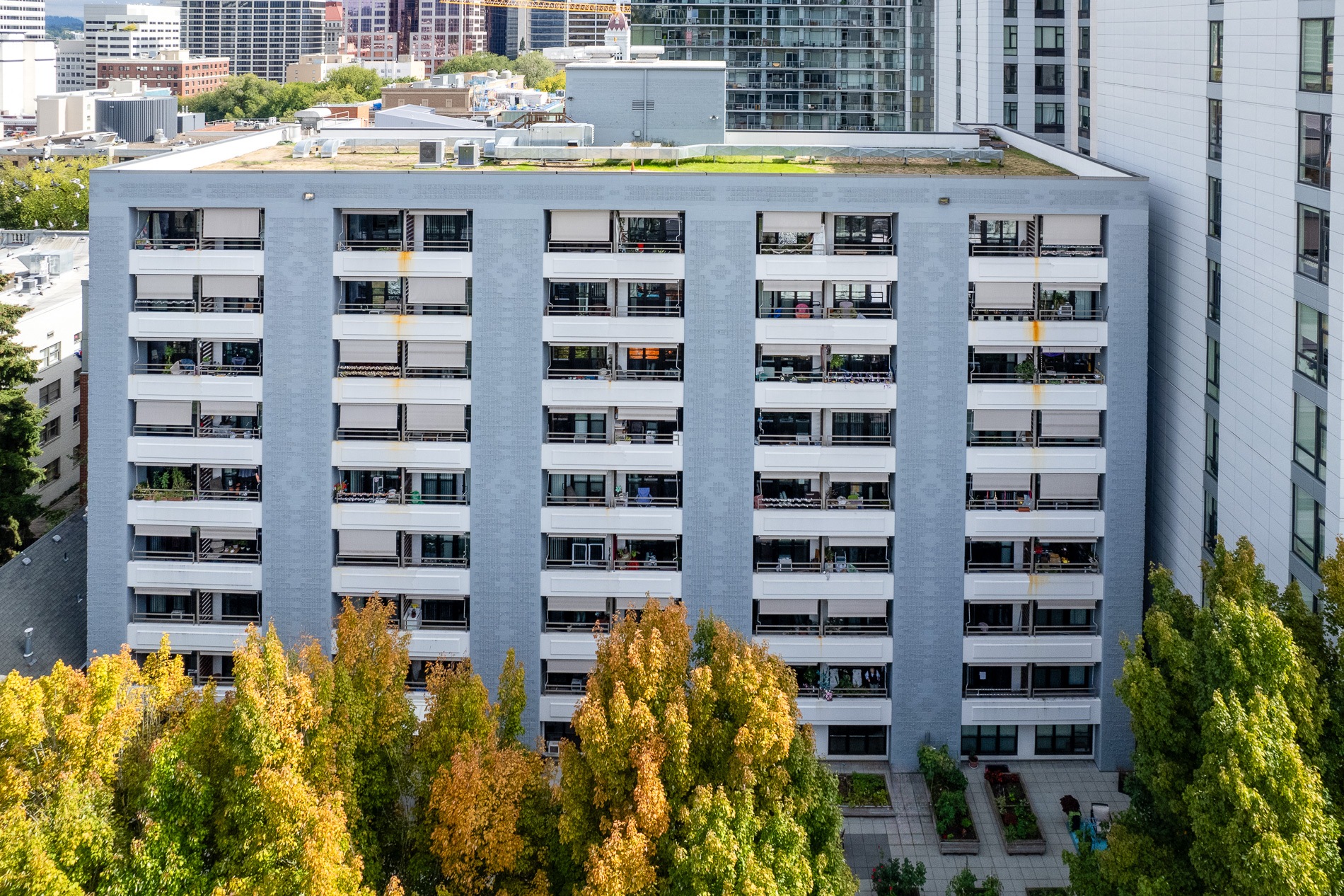 an aerial view of a large building surrounded by trees